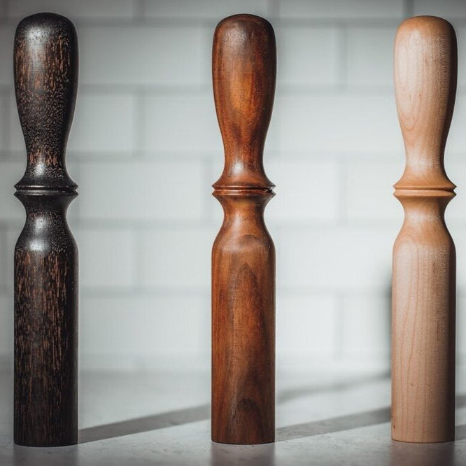 Three handmade muddlers in multiple woods
